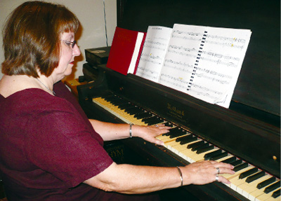 Pidcoke church pianist produces joyful strains on little country church's century-old grand piano